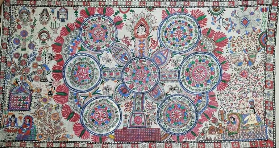 This painting is known as traditional Madhubani painting, it is called Kohbar painting, in this painting blue and black color has been used, maximum katchini design has been done and seven circles have been designed in it. hey